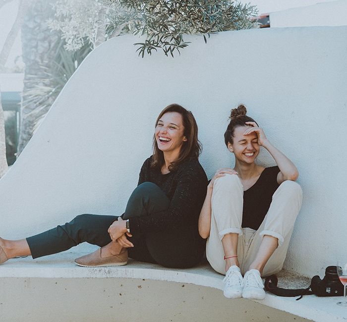 Two women sitting on a bench