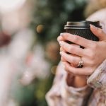 woman holding a hot drink