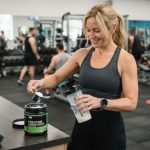woman mixing creatine